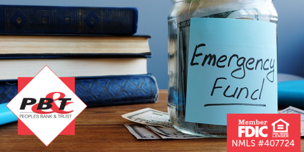 Jar full of cash labeled Emergency Fund with stack of books in the background