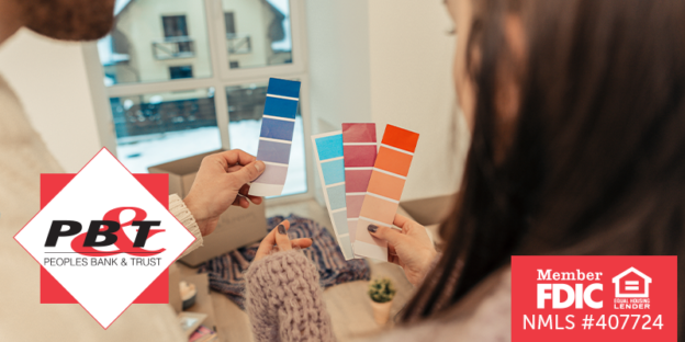 Couple looking at paint swatches together